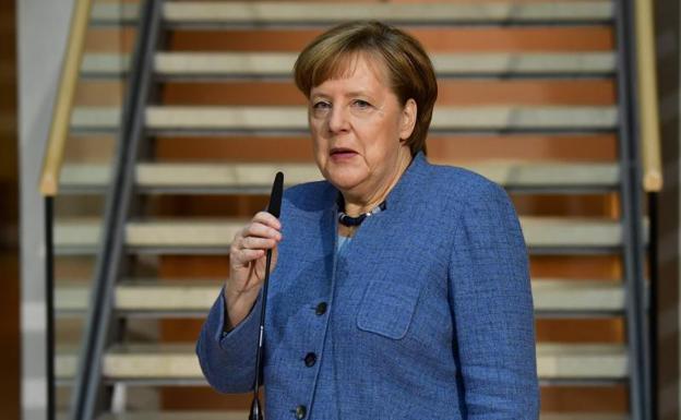 Angela Merkel, durante una comparecencia a su llegada a la sede del SPD./Tobias Schwarz (Afp)