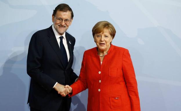 Rajoy y Merkel./Efe